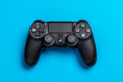 PS4 controller on blue background