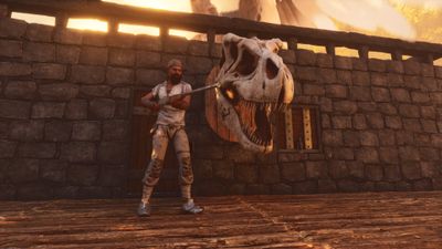 Ark: Survival Ascended - Holding a rifle in front of Rex trophy skull hanging on wall